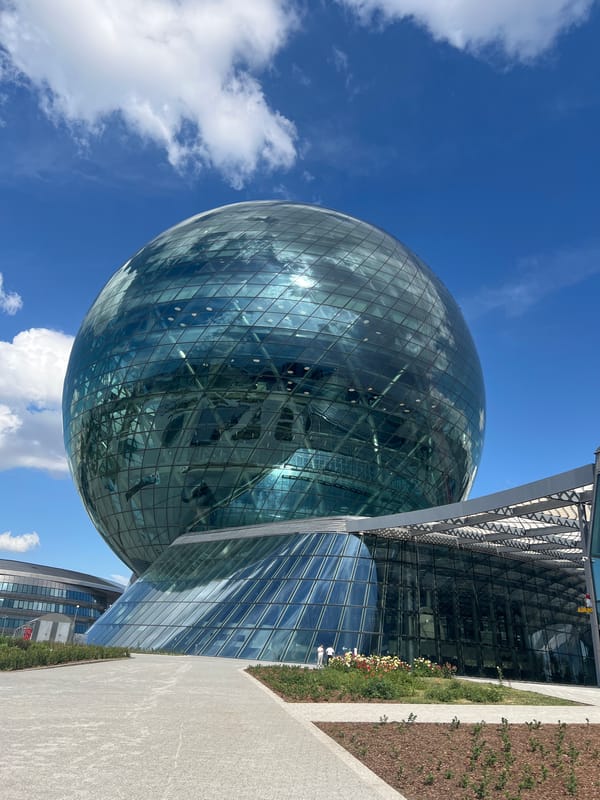 Visitors document Astana's iconic glass sphere pavilion complex