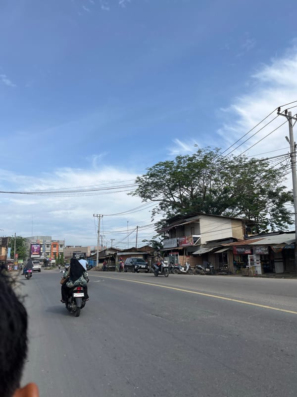 Bridge crossing and street scenes through Kota Kuala Simpang, Indonesia