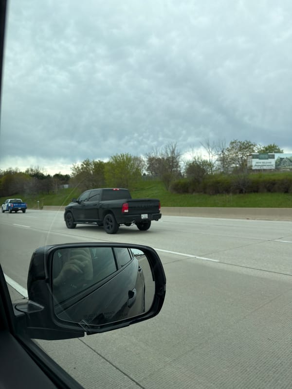 Highway traffic observed near Toronto featuring black pickup trucks