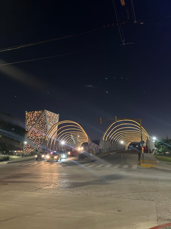 Nighttime photography captures illuminated Córdoba landmarks and geometric architecture