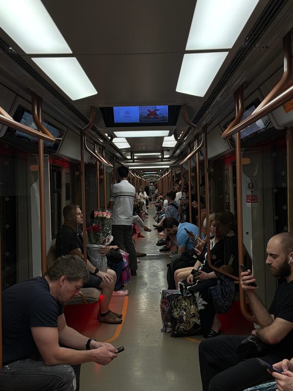 Crowded Moscow Metro car captures typical morning commute scene