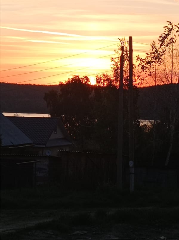 Sunset observed over Degtyarsk, Russia with contrails visible