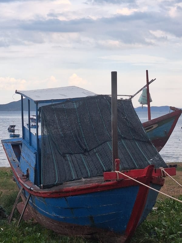 Nha Trang beachfront life: boats, bathers, and coastal streets