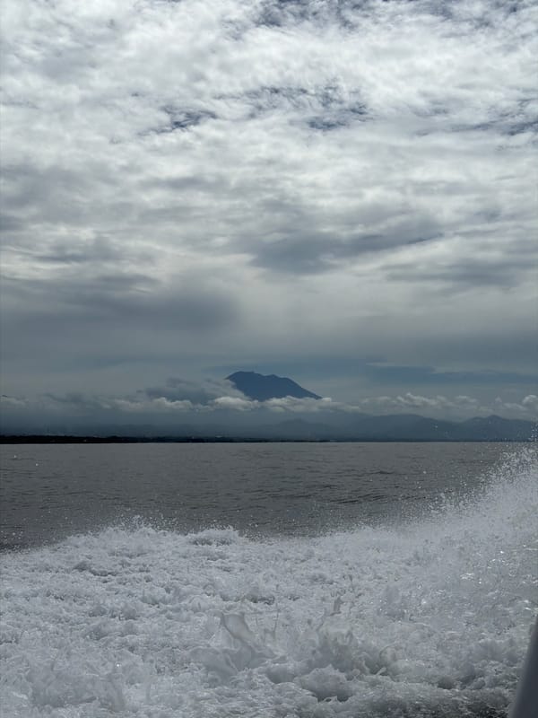 Mountain silhouette and waves captured in Indonesian landscape view