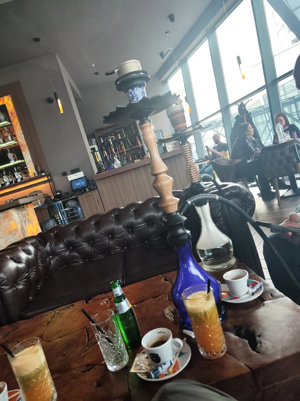 Cafe patron documents hookah and coffee service in Burgas