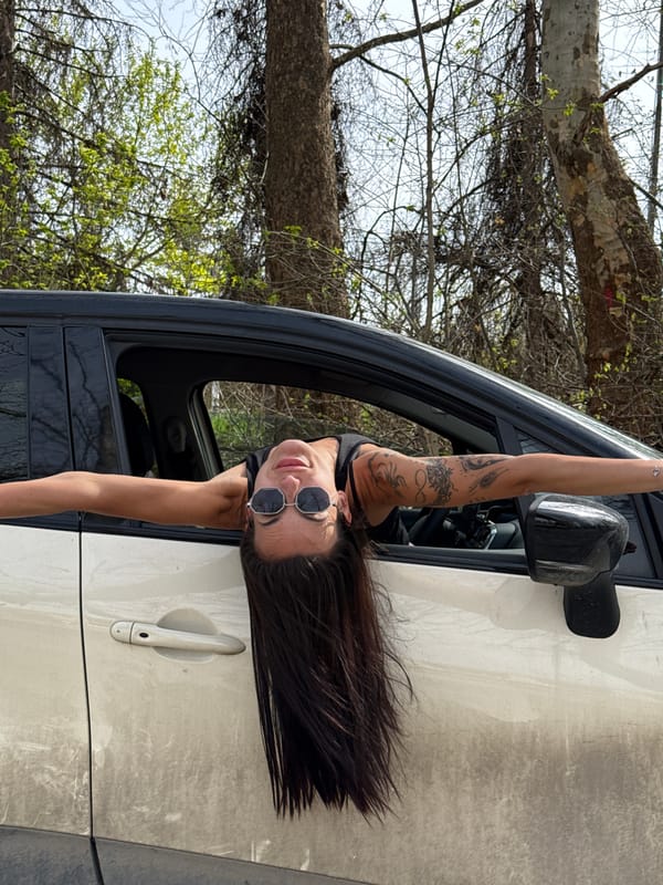 Woman leans from car window in Pleven, Bulgaria