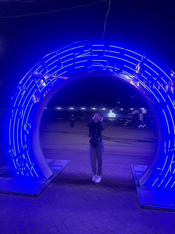 Blue neon music installation and Eastern European street at night