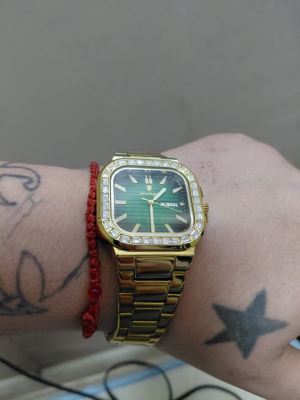 Person spotted wearing luxury gold watch with distinctive accessories