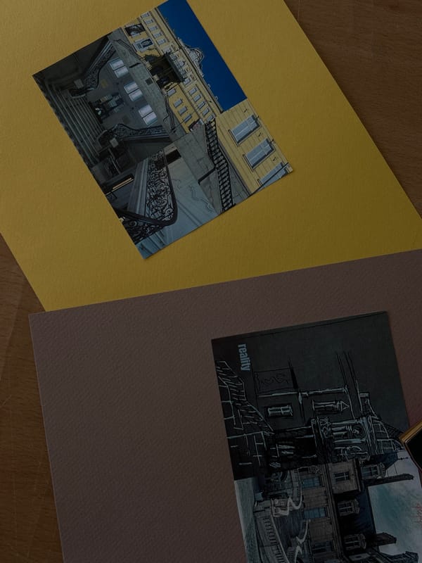 Sketchbooks and architectural drawings spread across a Sofia desk