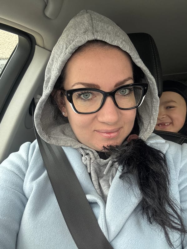 Woman and child photographed in parked car, Panagyurishte, Bulgaria