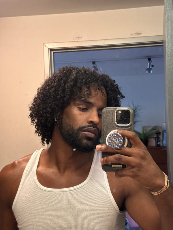 Man takes bathroom mirror selfie in Los Angeles