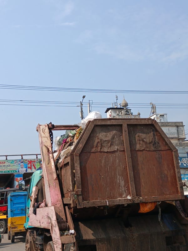 Overflowing garbage truck spotted on Dhaka street