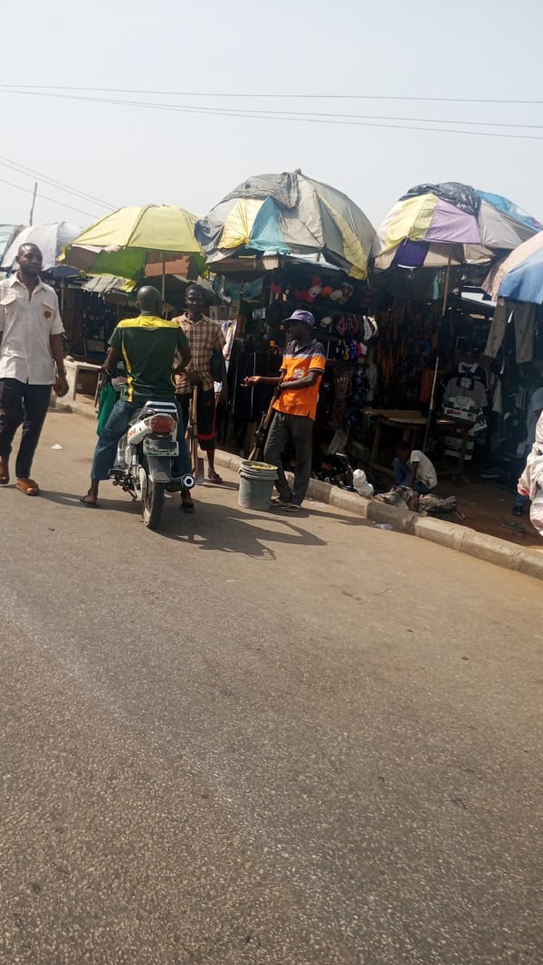 Morning market activity observed in Lokoja, Nigeria street scene