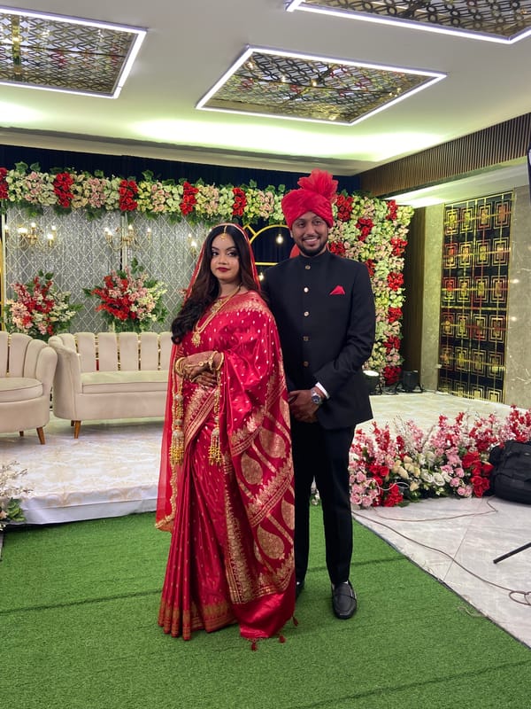 Wedding celebration captured in Dhaka with traditional attire and elaborate decorations