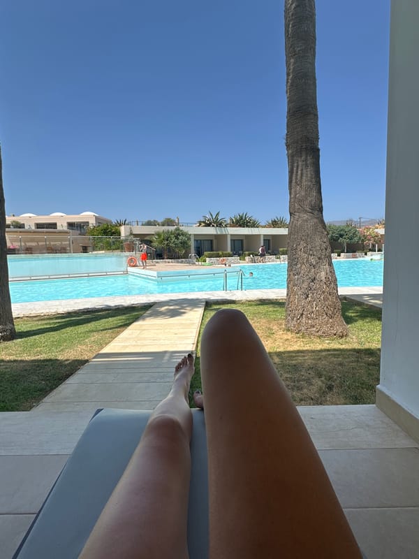 Relaxing poolside at a Greek resort in Tavronitis