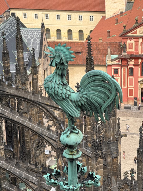Gothic spires and a verdigris rooster atop Prague's skyline