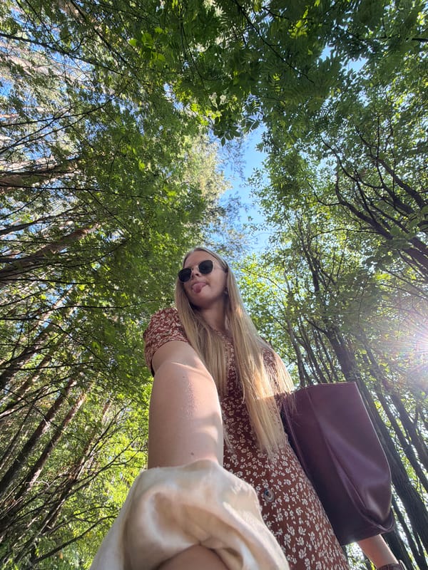 Outdoor selfie session in an Izhevsk forest, summer afternoon.