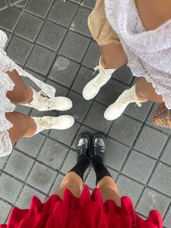 Four people gather on tiled surface in North Kuta