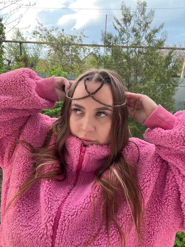 Woman photographs selfies indoors and outdoors in Novopokrovskaya