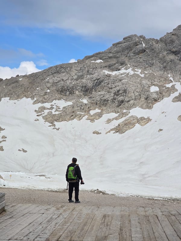 Snowy mountain viewpoint deck, Garmisch-Partenkirchen, June morning