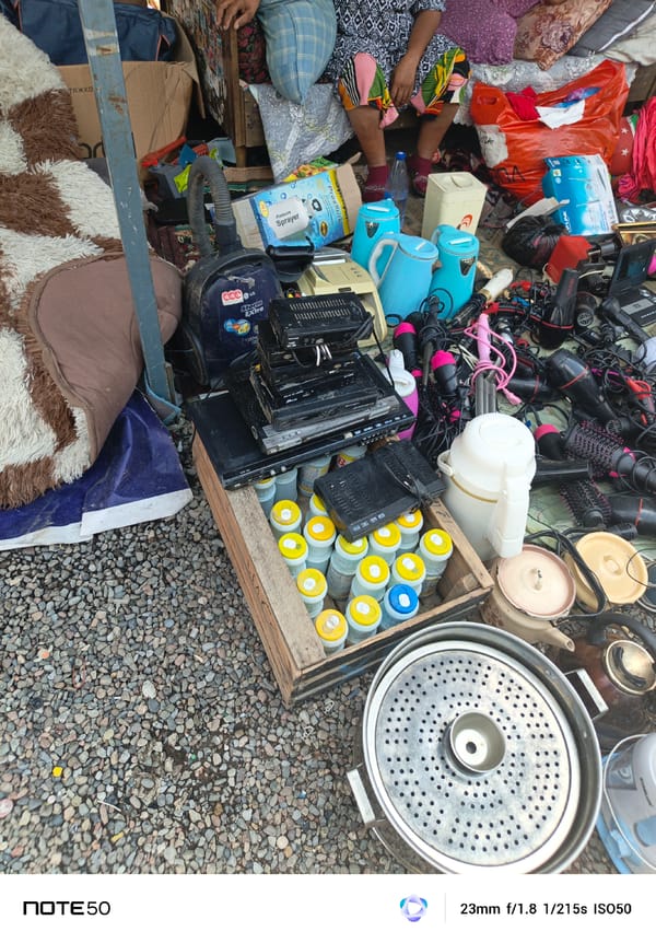 Flea market stalls and a street wedding setup side by side
