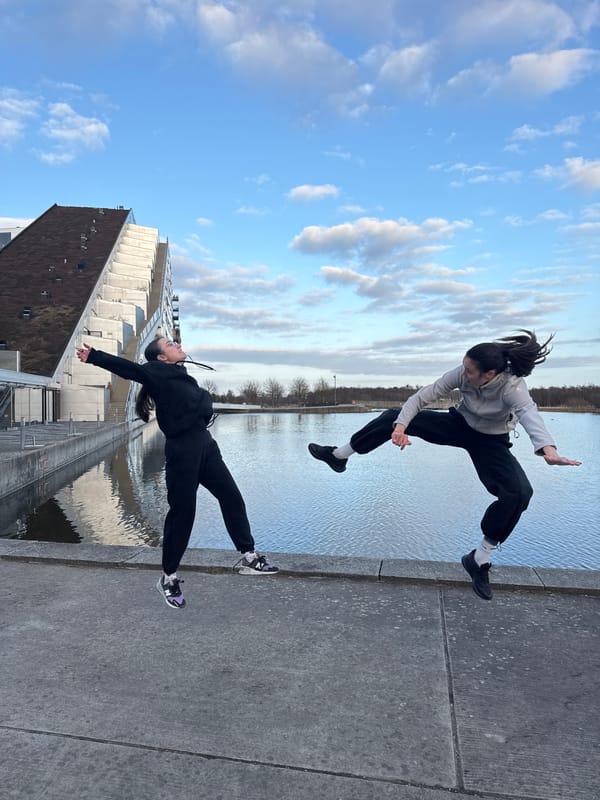 Sunset photo session with jumping poses in Copenhagen waterfront