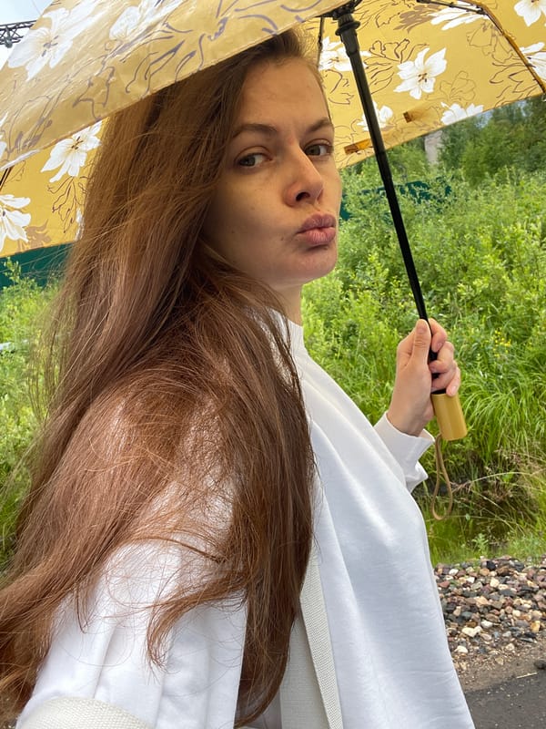 Rainy afternoon walk in Zarechny with cows, chickens, and a yellow umbrella