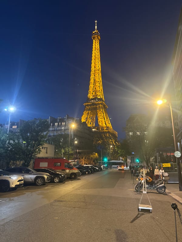 Eiffel Tower photographed illuminated against evening sky in Paris