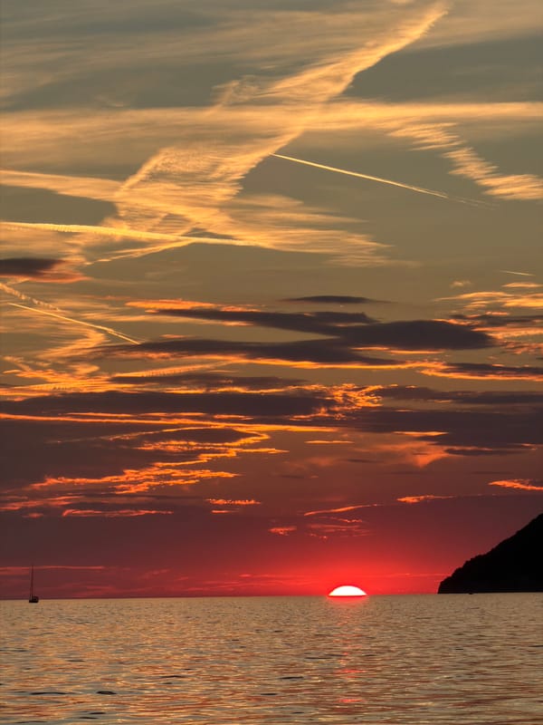 Adriatic sunset and docked sailboats along the Bar waterfront