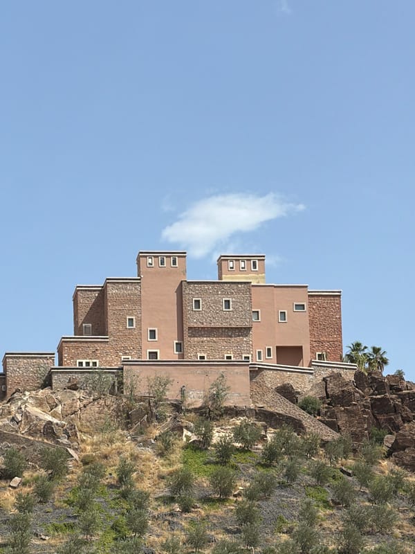 Terraced building complex observed on rocky hillside in Marrakesh