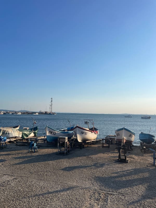 Pomorie harbor at golden hour, boats ashore on the Black Sea coast.