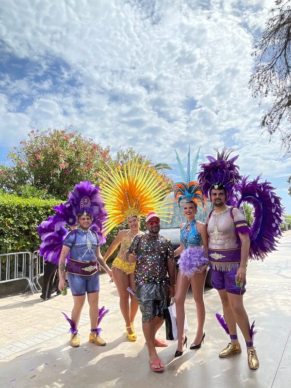 Pride parade with elaborate floats and costumes in Sitges