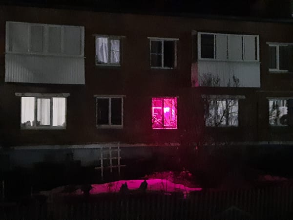 Magenta light observed in residential building window in Russia