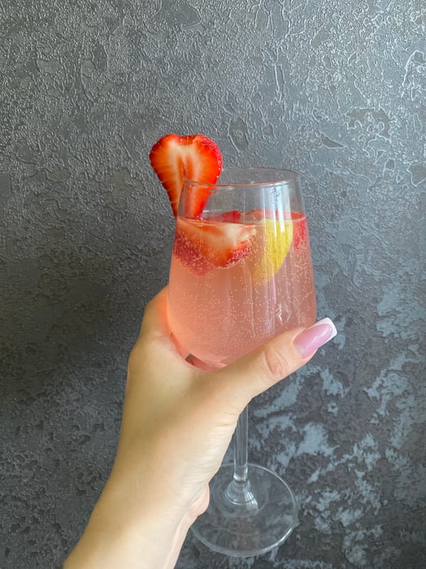 Woman enjoys strawberry cocktail during afternoon in Izhevsk