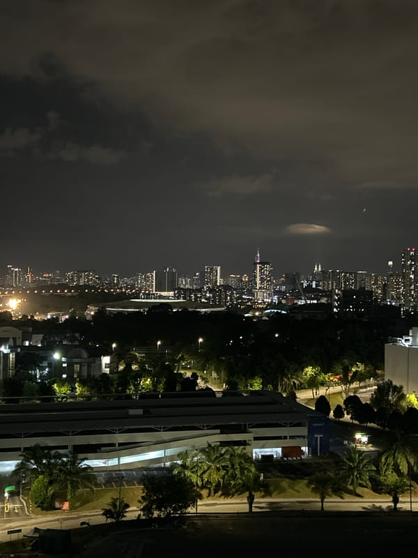 Nighttime Kuala Lumpur skyline captured from elevated viewpoint