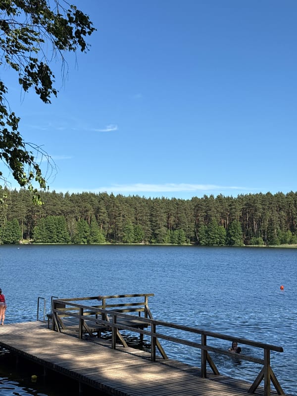 Sunny lake day outside Vilnius, beach and pier