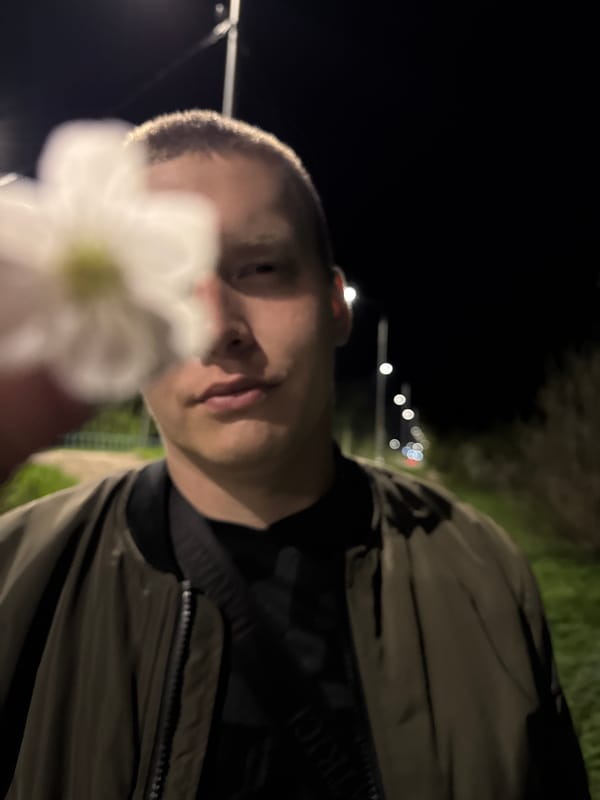 Nighttime flower pose and street exercise captured in Dmitrov