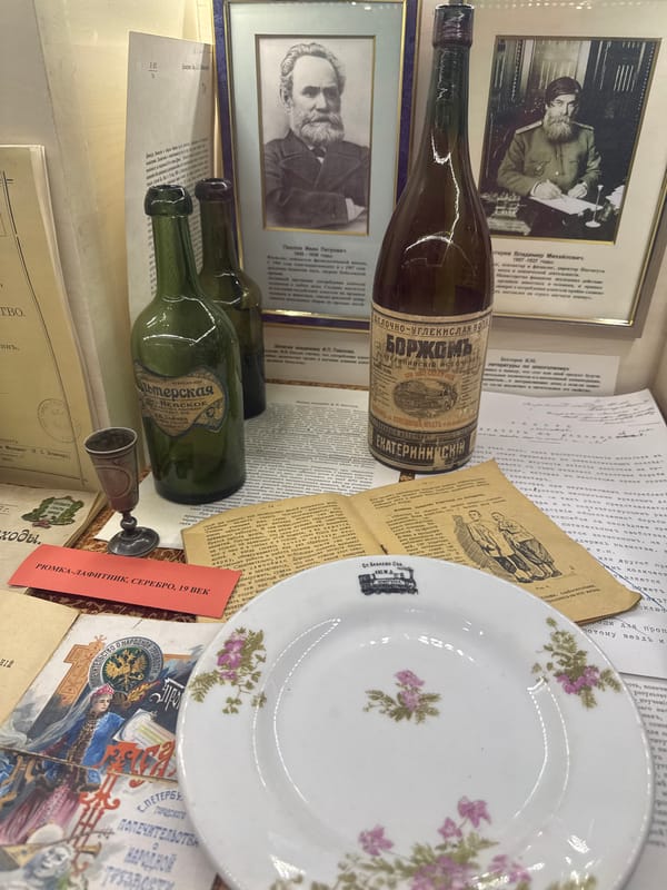 Visitor documents historical artifacts at Saint Petersburg museum exhibition