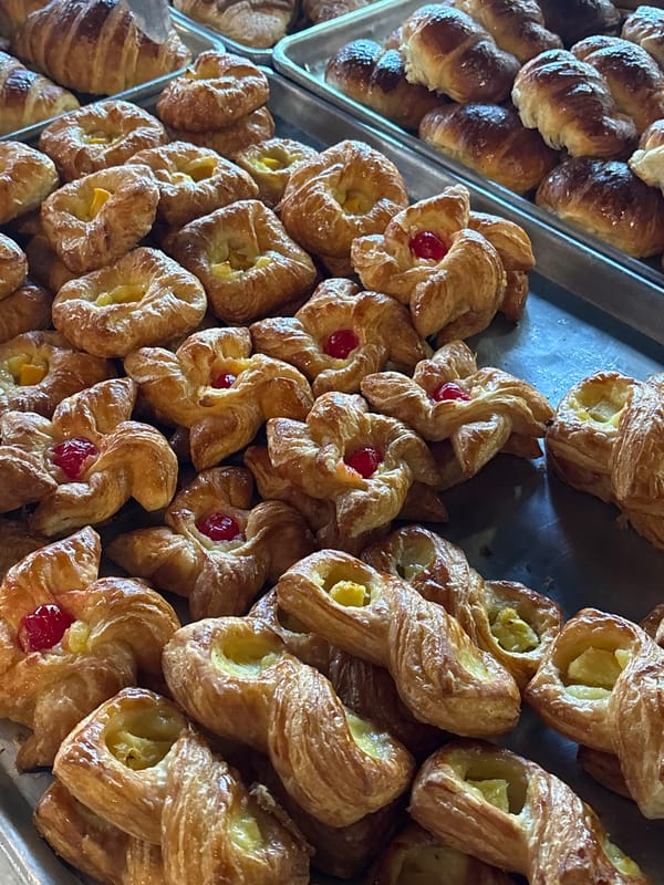 Bakery items and outdoor dining documented at San Isidro establishment