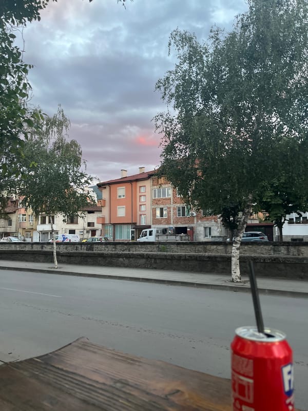 Red soda can on a wooden surface at dusk, Gotse Delchev