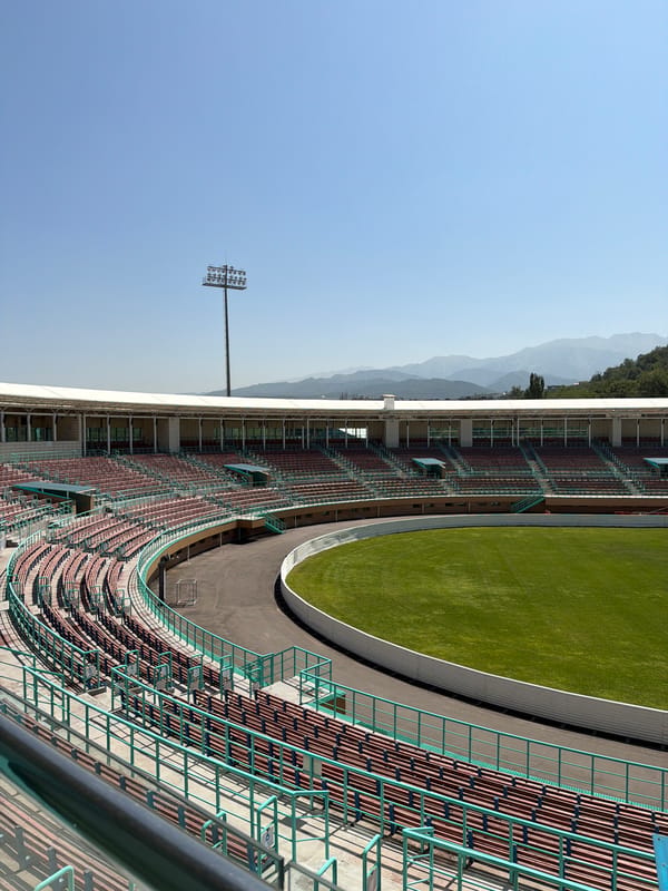 Almaty's Central and Ski Jump stadiums on a sunny day