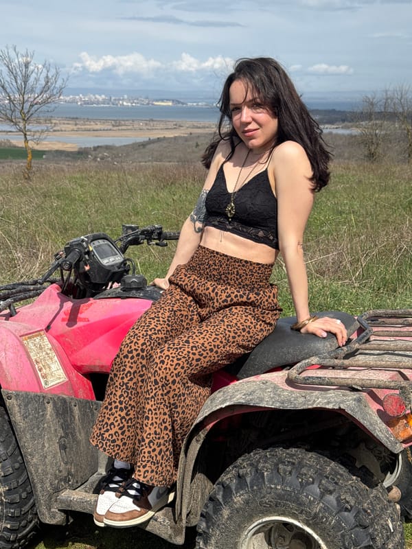Woman on red ATV overlooking water near Burgas