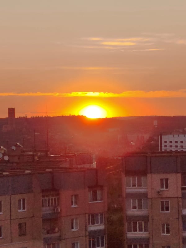 Evening scenes from Kryvyi Rih: sunsets, city nights, dog playtime
