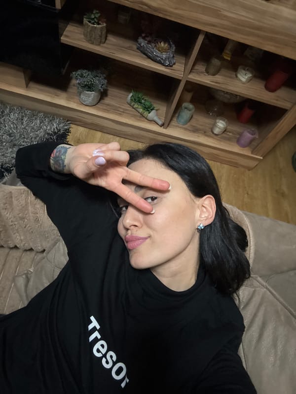 Woman photographed relaxing on couch in Tbilisi residence