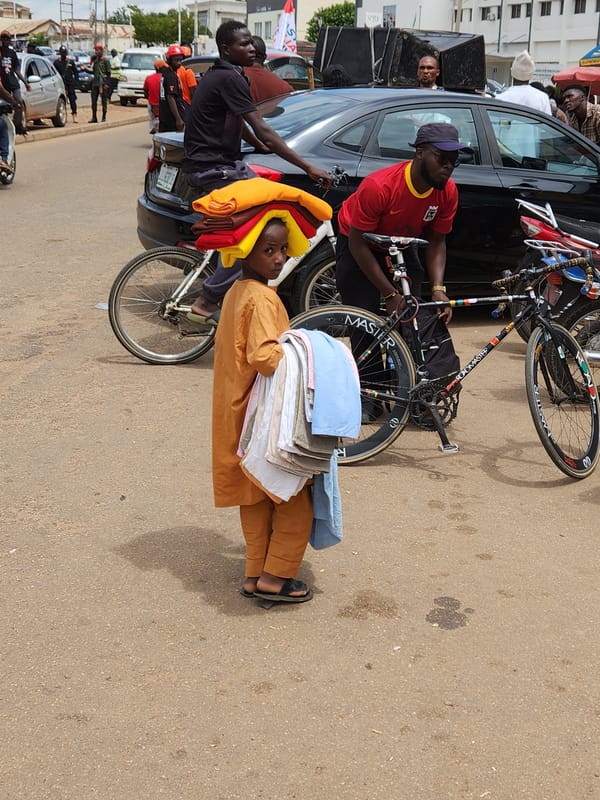 Organized group in orange gathers on the streets of Jos