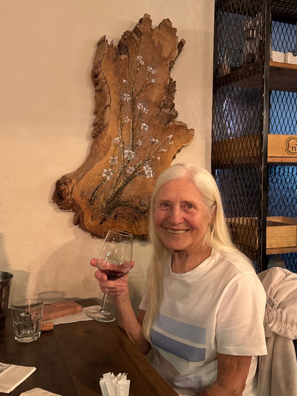 Elderly woman enjoys dinner at upscale Eilat restaurant