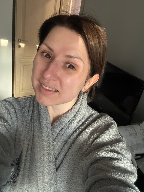 Woman in gray robe photographed in Sofia home