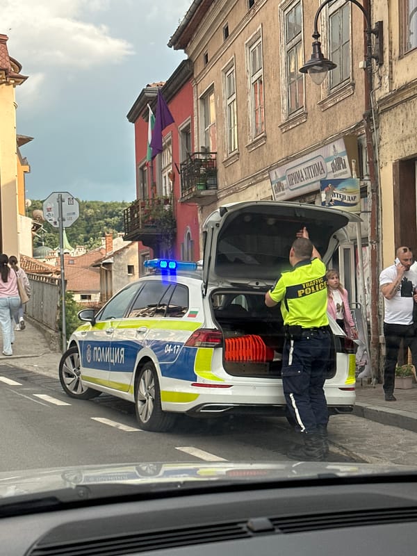 Traffic officer inspects police vehicle in Veliko Tarnovo