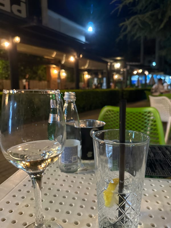 Drinks on a table at a Dimitrovgrad outdoor café, evening