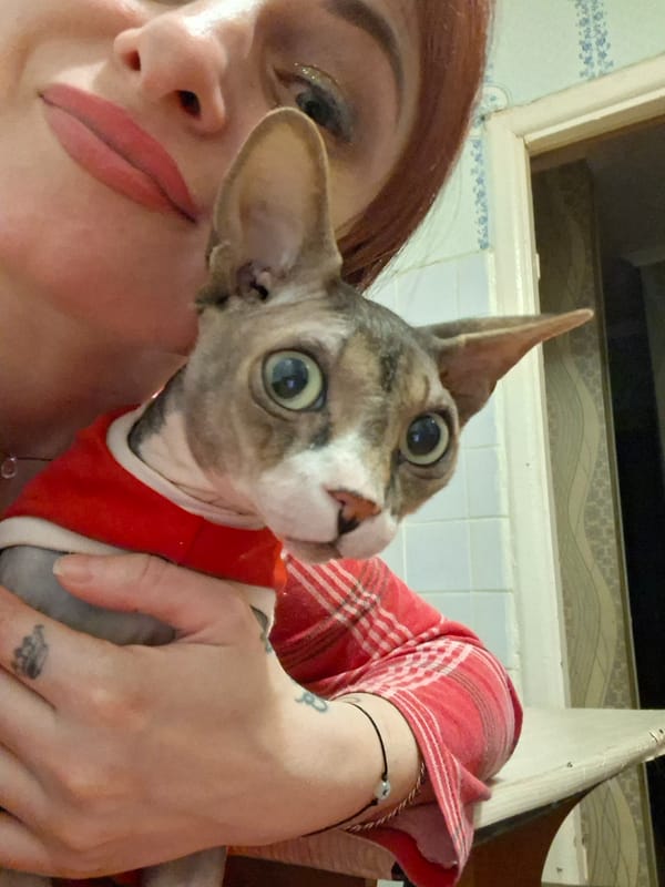 Couple documents afternoon with hairless cat in rural Belarus
